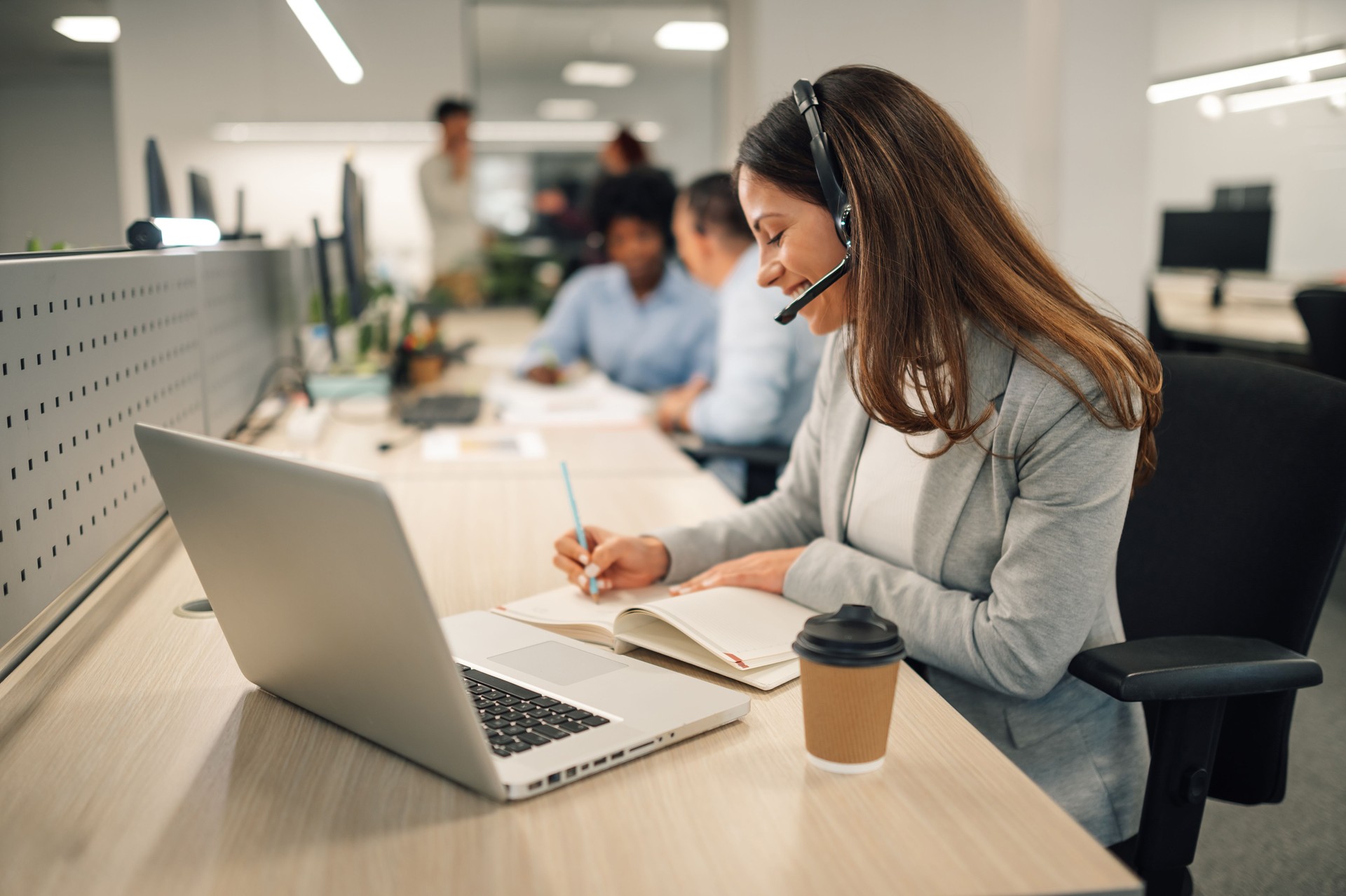 A customer support agent is working at call center.